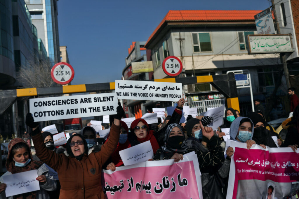 Afghan women shout slogans during a rally to protest against what the protesters say is Taliban restrictions on women, in Kabul, Afghanistan, on 28th December, 2021.