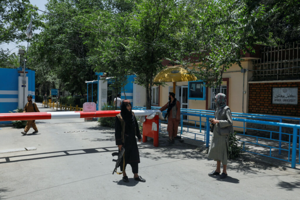 Taliban soldiers are seen at a checkpoint at the entrance of Kabul University in Kabul, Afghanistan, on 14th June, 2023