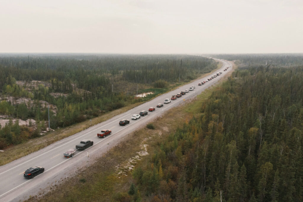 Yellowknife residents leave the city on Highway 3, the only highway in or out of the community, after an evacuation order was given due to the proximity of a wildfire in Yellowknife, Northwest Territories, Canada, on 16th August.