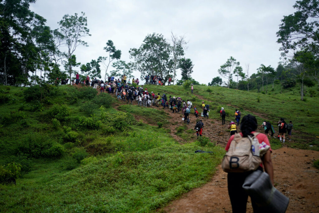 A group of migrants from different countries walk through the Darien Gap, as they continue their journey to the US border, in Acandi, Colombia, on 9th July, 2023.