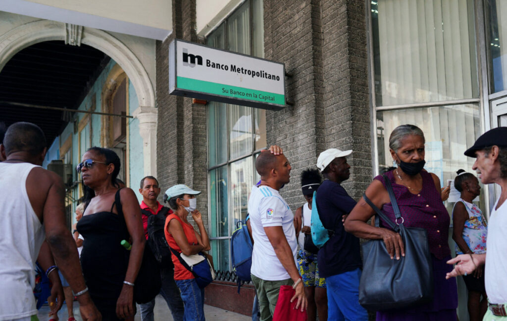 People wait in line to enter a bank in Havana, Cuba, on 18th August, 2023