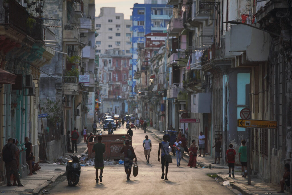 People walk on the street in downtown Havana, Cuba, on 14th April, 2023