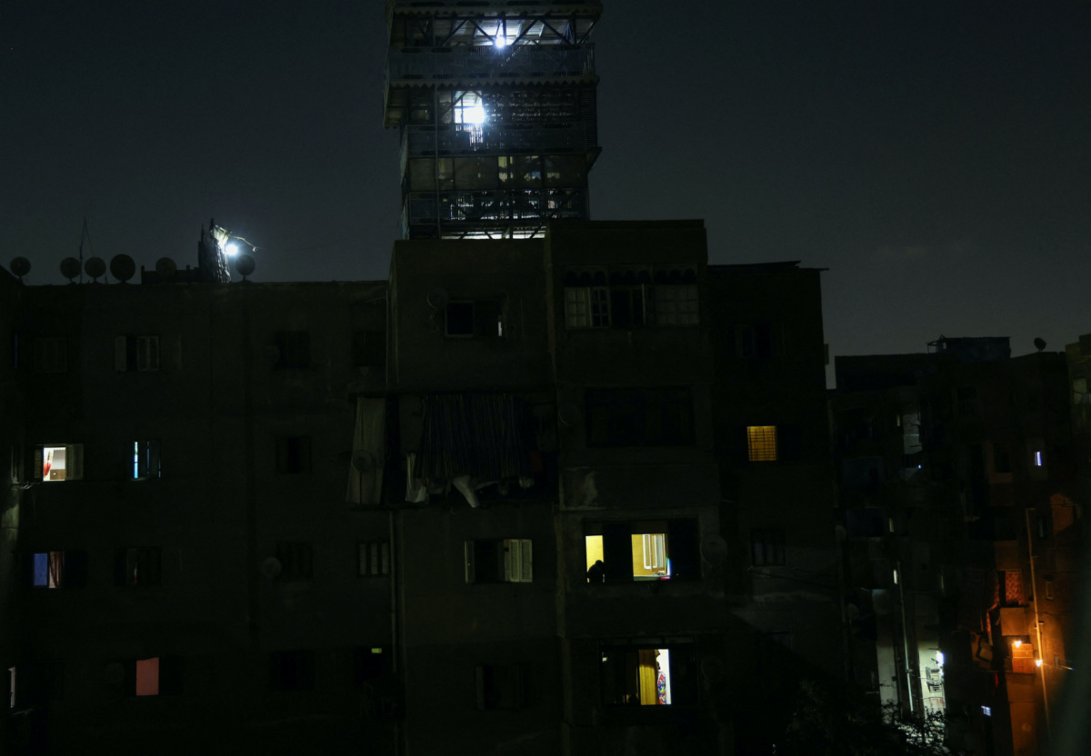 A general view shows different dark areas in the capital Cairo during planned power cuts to reduce energy consumption as planned by the Egyptian government during this month, when the country and the region are facing a brutal heat wave, in Cairo, Egypt, on 3rd August, 2023