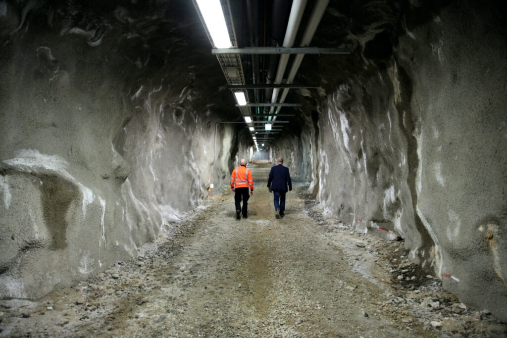Security specialist Tapio Hietakangas walks with an employee in a tunnel of Santa Park near Rovaniemi, Finland, on 24th May, 2022