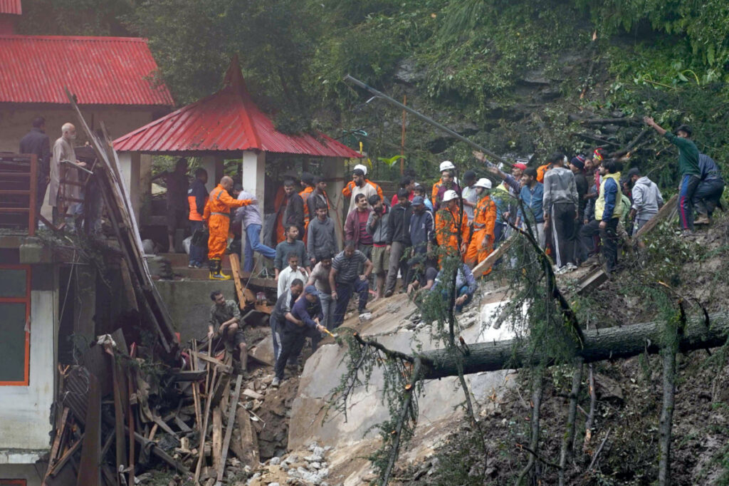 Rescue workers remove the debris as they search for survivors after a landslide following torrential rain in Shimla in the northern state of Himachal Pradesh, India, 14th August, 2023