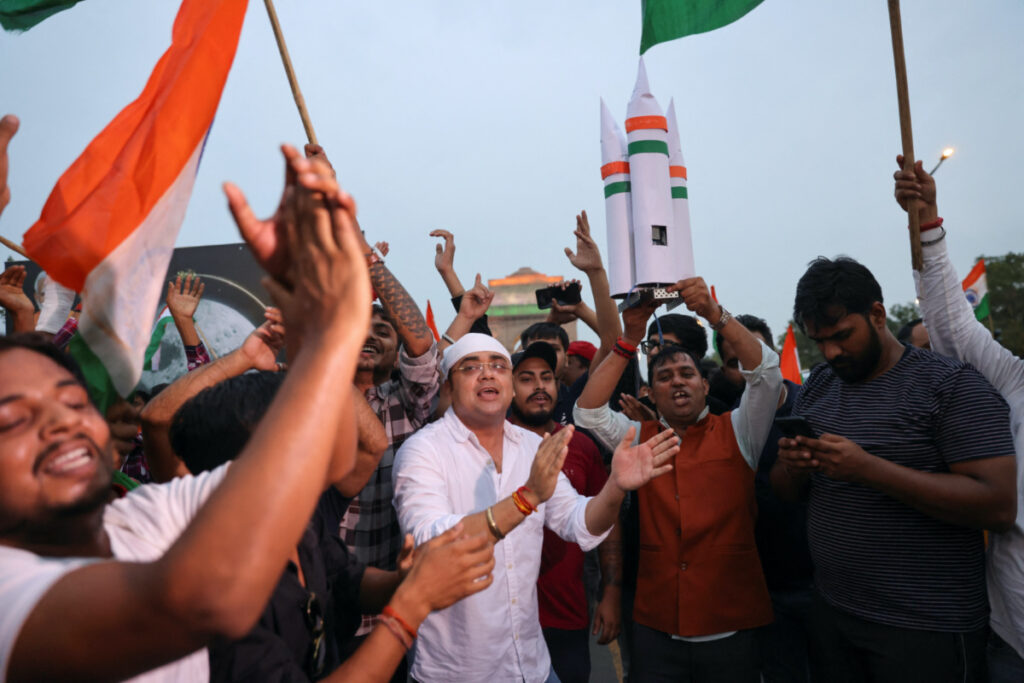 People and supporters of India's ruling Bharatiya Janata Party celebrate the Chandrayaan-3 spacecraft's landing on the Moon at an event organised near India Gate in New Delhi, India, on 23rd August, 2023