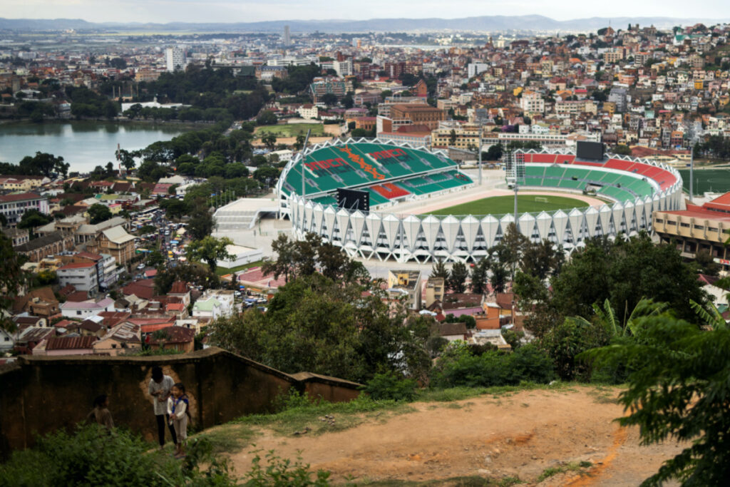 Children stand on a hill as the Mahamasina Municipal Stadium is seen in the background in Antananarivo, Madagascar, on 3rd February, 2022