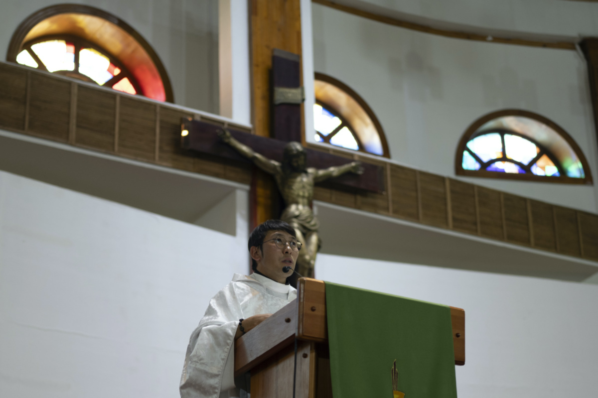 Sanjaajav Tserenkhand, the Assistant Priest of Saint Peter and Paul Cathedral, conducts a mass at the Catholic Church in Ulaanbaatar, Mongolia on Monday, 28th August, 2023