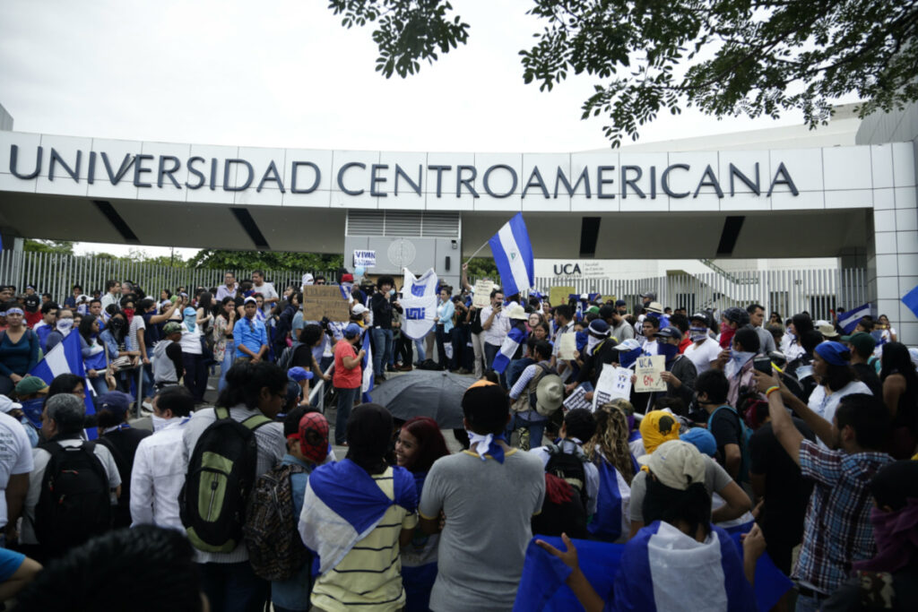Demonstrators protest outside the Jesuit-run Universidad Centroamericana demanding the university's allocation of its share of six per cent of the national budget in Managua, Nicaragua, on 2nd August, 2018