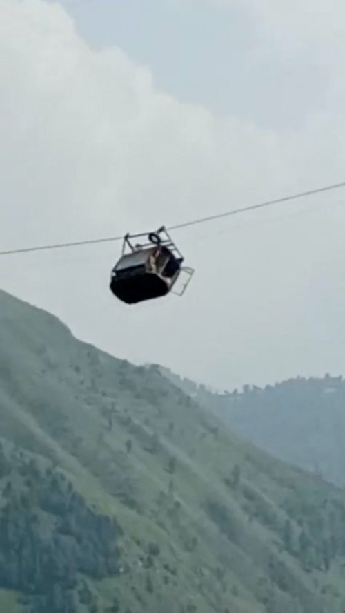 A view shows cable car carrying students stranded mid-air in Battagram, Pakistan, on 22nd August, 2023, in this screen grab obtained from social media video.