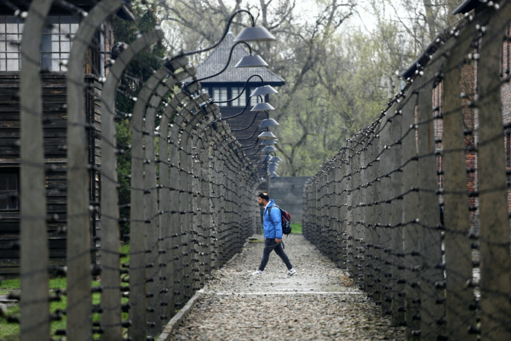 A man walks through the grounds of the former Nazi German Auschwitz death camp for the annual International "March of the Living" in Oswiecim, Poland, on 18th April, 2023.