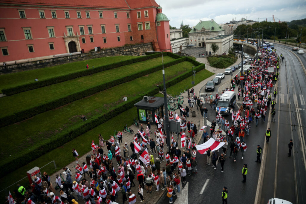 People take part in Belarusians' march through Warsaw on the third anniversary of the 2020 presidential election which was followed by mass protests over alleged electoral fraud, in Warsaw, Poland, on 9th August, 2023