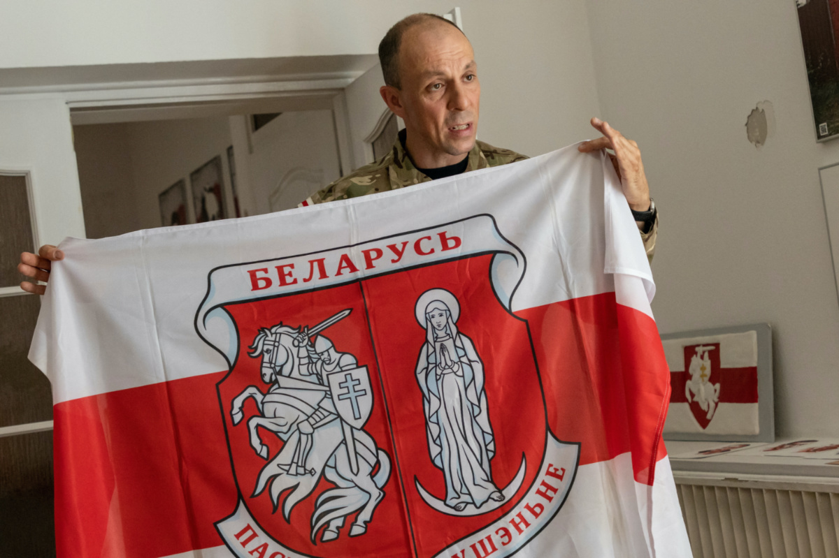 Commander of Paspalitaje Rusennie, a Belarusian paramilitary group operating in Poland and Lithuania, Sergey Kedyshko, holds the flag of the group, in Warsaw, Poland, on 27th July, 2023.