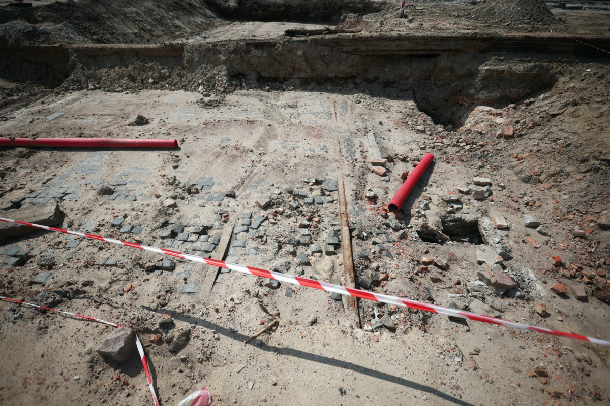 Tram tracks are seen at a site where the remains of long-lost streets buried underground are uncovered during the construction of a square in front of Palace of Culture and Science in Warsaw, on 17th August, 2023.