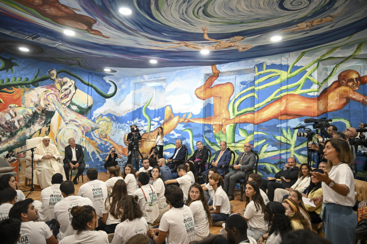 Pope Francis and Scholas Occurrentes' President Jose Maria del Corral, second from left, attend a meeting with members of the Scholas Occurrentes community of young people, an International educational movement created by Pope Francis himself, in Cascais, 25 kilometers south of Lisbon, on Thursday, 3rd August, 2023.