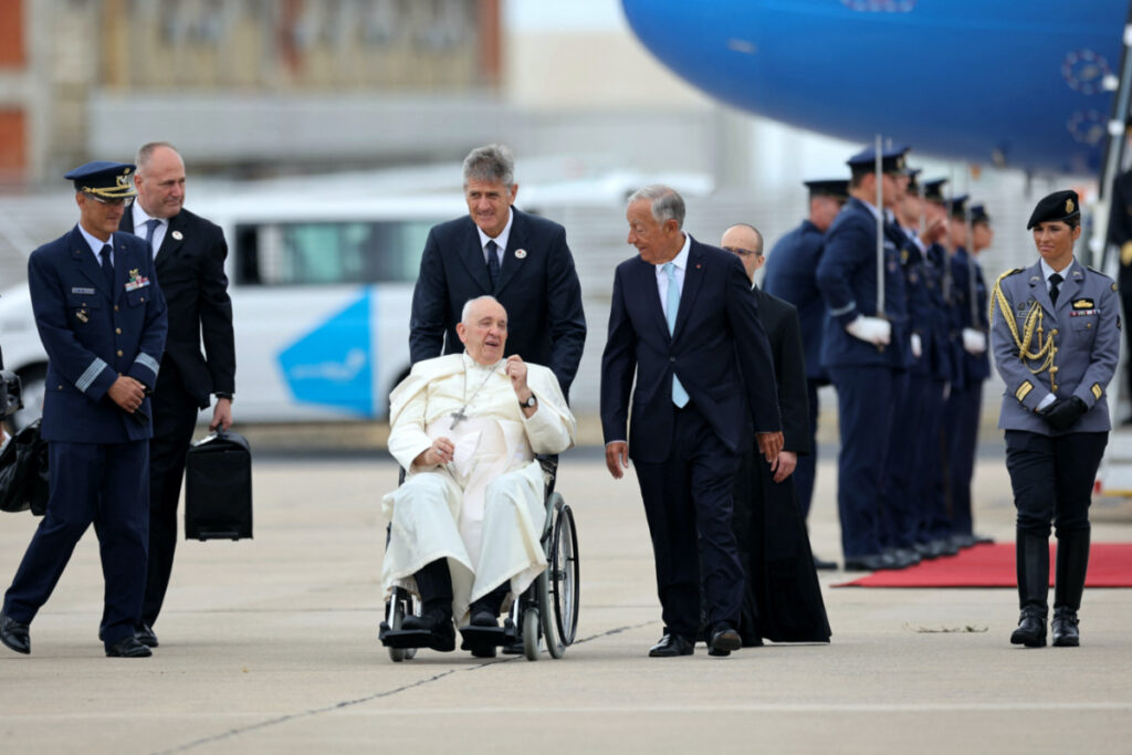 Pope Francis is welcomed by Portugal's President Marcelo Rebelo de Sousa upon his arrival at Figo Maduro airbase in Lisbon, Portugal, on 2nd August 2023.