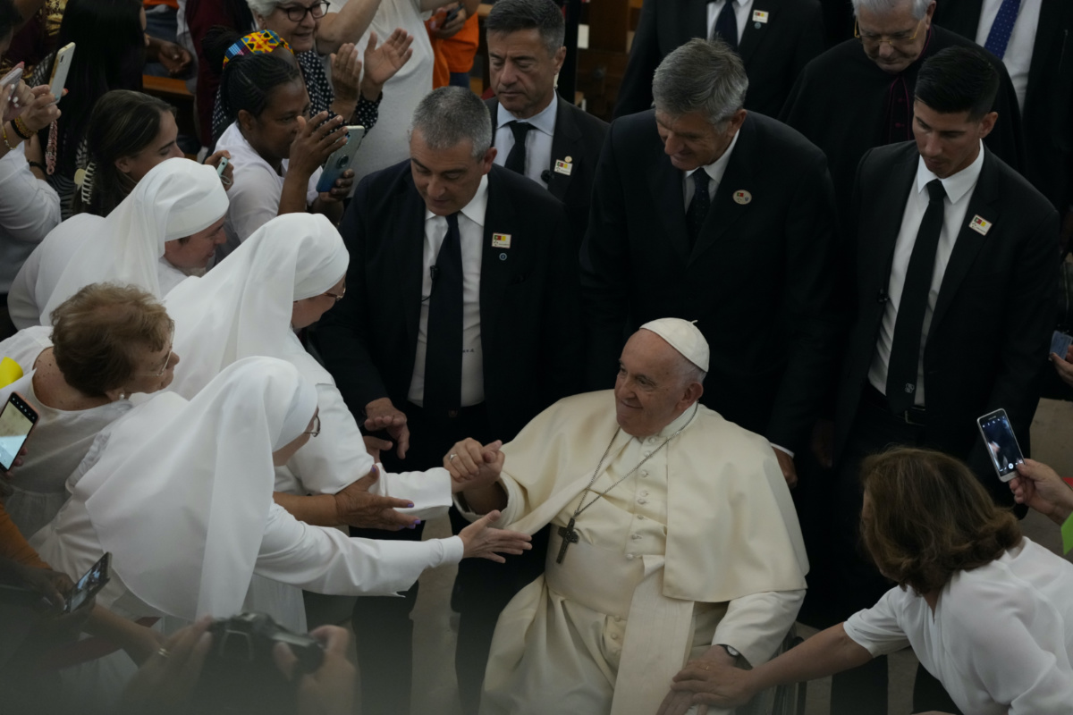 Pope Francis leaves the parish of Serafina at the end of a meeting with representatives of some aid and charity centers ahead of Sunday's 37th World Youth Day in Lisbon, on Friday, 4th August, 2023