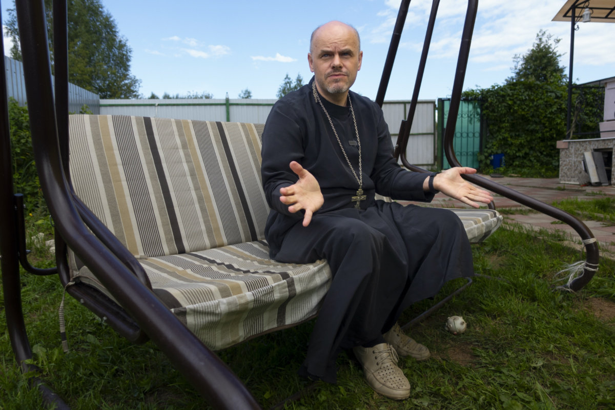 The Rev. Ioann Burdin gestures while speaking at the courtyard of his house in the village of Nikolskoye, Kostroma Region, 91 kilometres north-east of Moscow, Russia, Monday, on 17th July 2023.