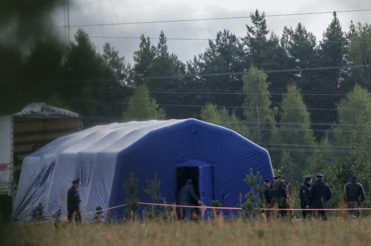 Police officers keep guard at a checkpoint near the site of the crash of a private jet linked to Wagner mercenary chief Yevgeny Prigozhin in the Tver region, Russia, on 24th August, 2023