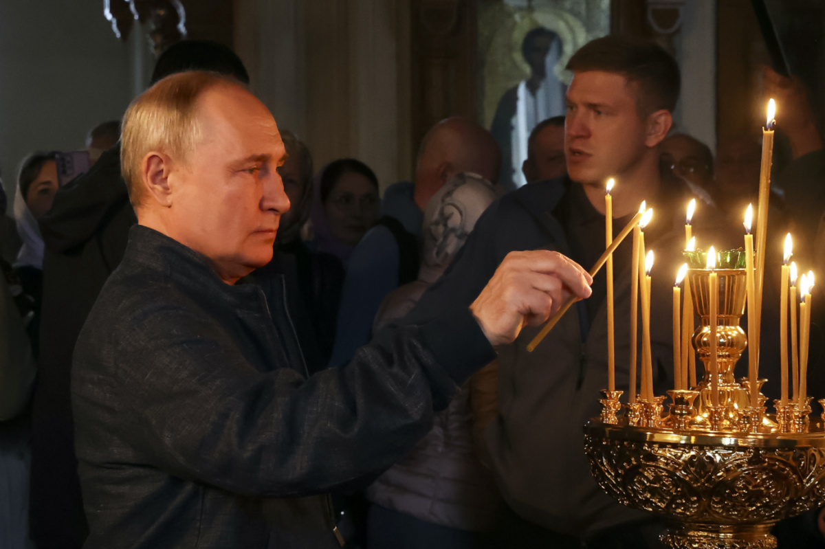 Russian President Vladimir Putin lights a candle as he visits the Valaam Monastery of the Transfiguration of the Savior, on Valaam island in Ladoga Lake, Republic of Karelia, Russia, Monday, on 24th July, 2023. 