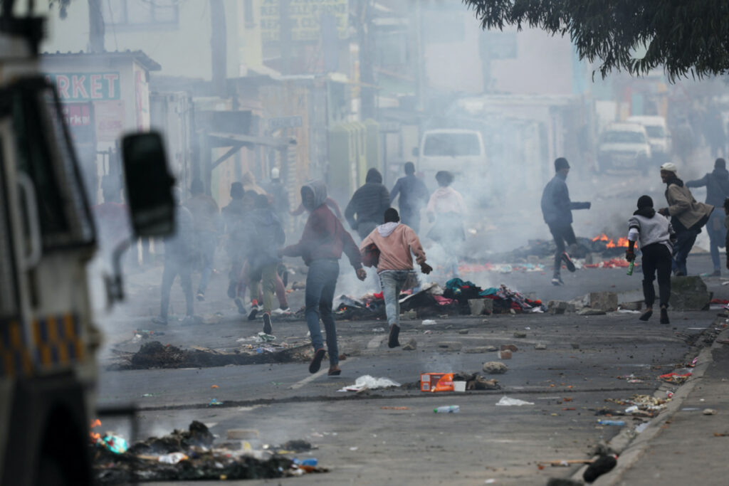Protesters in Masiphumelele clash with Cape Town's law enforcement amidst an ongoing strike by taxi operators against traffic authorities in Msiphumelele, Cape Town, South Africa, on 8th August, 2023
