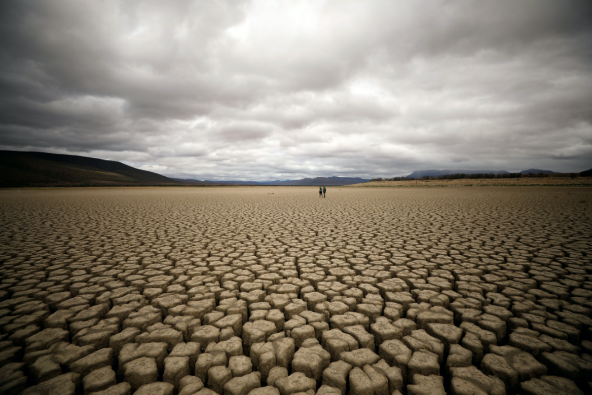 Clouds gather but produce no rain as cracks are seen in the dried up municipal dam in drought-stricken Graaff-Reinet, South Africa, on 14th November, 2019