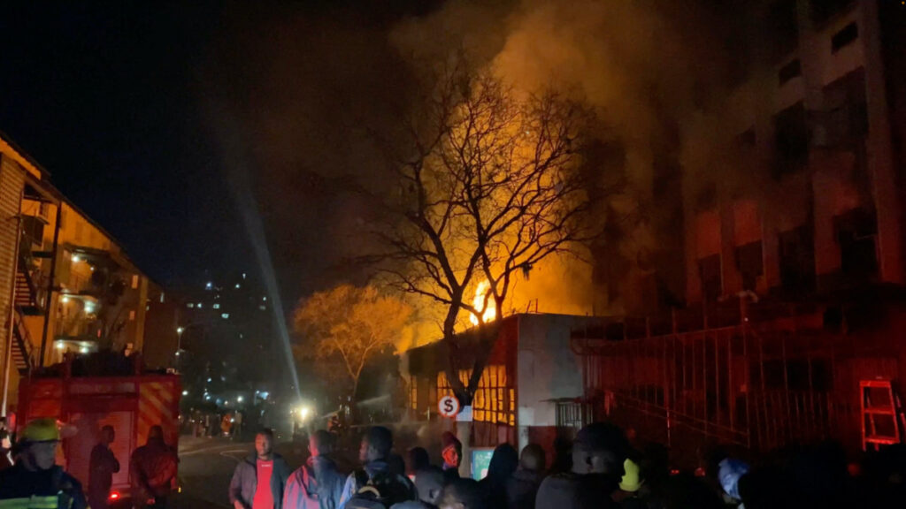 Flames rise from a building amid a deadly fire, in Johannesburg, South Africa, on 31st August, 2023