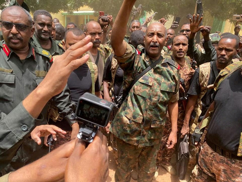 Sudan's General Abdel Fattah al-Burhan stands among troops,in an unknown location, in this picture released on 30th May, 2023