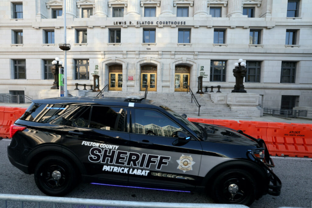 A sheriff's vehicle passes by the Lewis R Slaton Courthouse and Superior Court of Fulton County, after a Grand Jury brought back indictments against former US President Donald Trump and 18 of his allies in their attempt to overturn the state's 2020 election results, in Atlanta, Georgia, US, on 17th August, 2023.