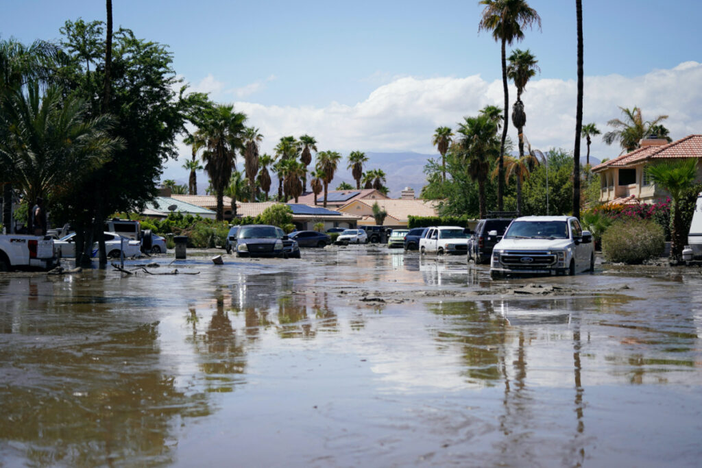 Cars partially submerged in water and mud sit on a street following Tropical Storm Hilary in Cathedral City, California, US, on 21st August, 2023