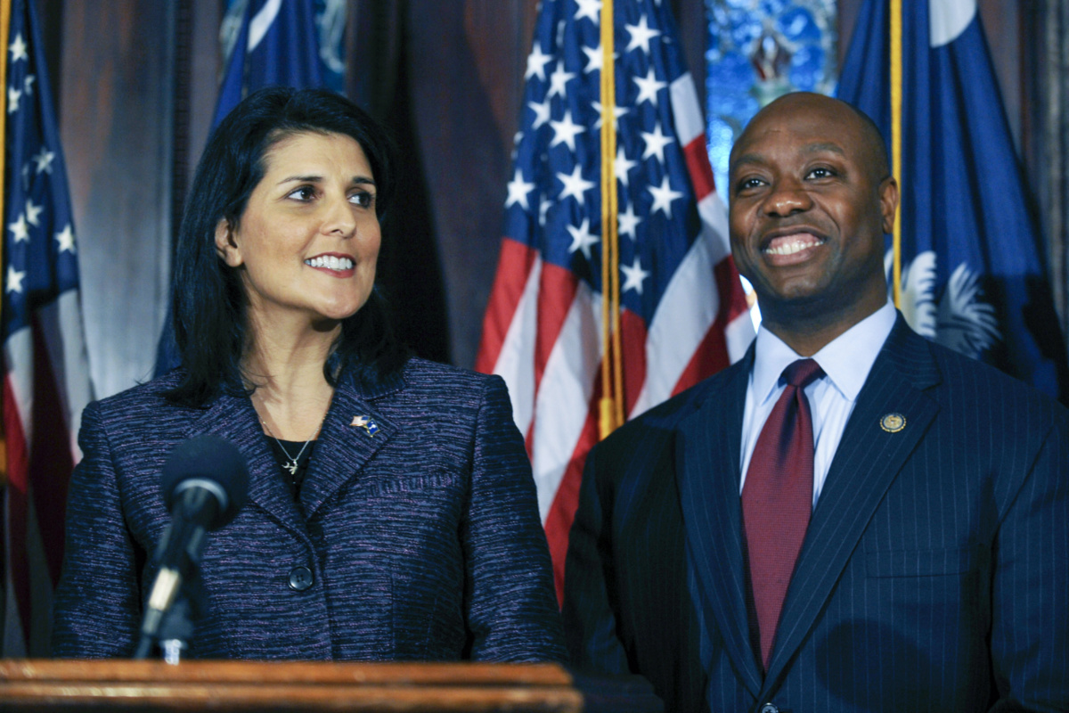 South Carolina Gov Nikki Haley, left, announces Rep Tim Scott, right, as Sen Jim DeMint's replacement in the US Senate during a news conference at the South Carolina Statehouse, on 17th December, 2012, in Columbia, South Carolina.
