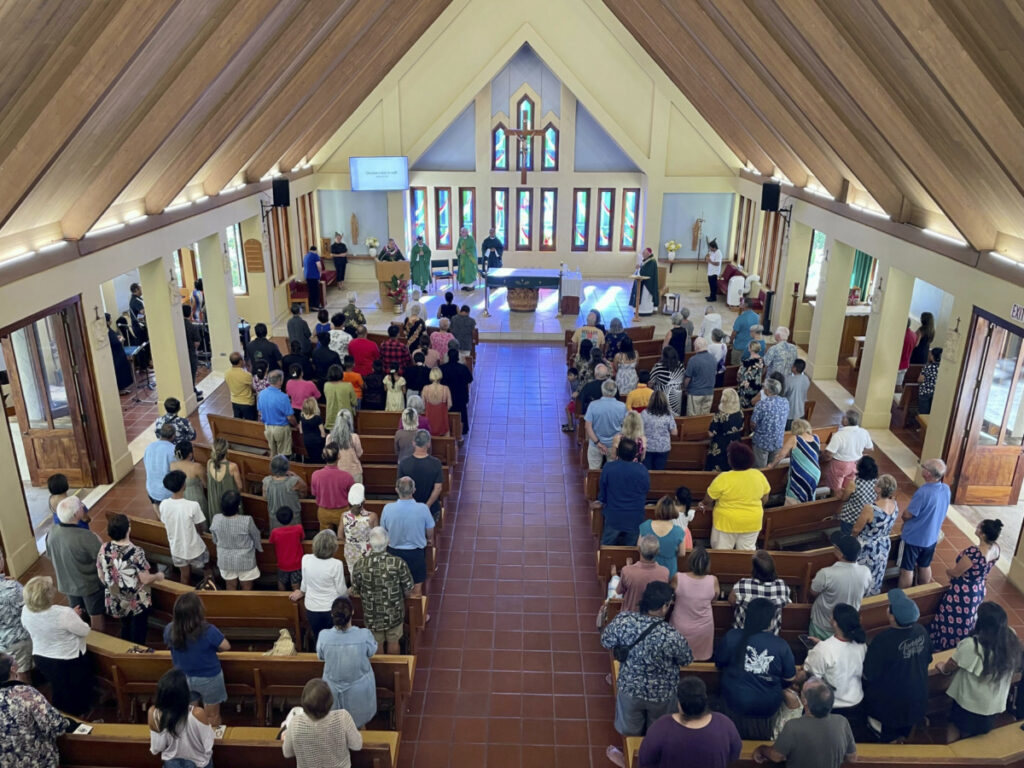 Parishioners attend Mass at Sacred Hearts Mission Church in Kapalua, Hawaii, on Sunday, 13th August, 2023.