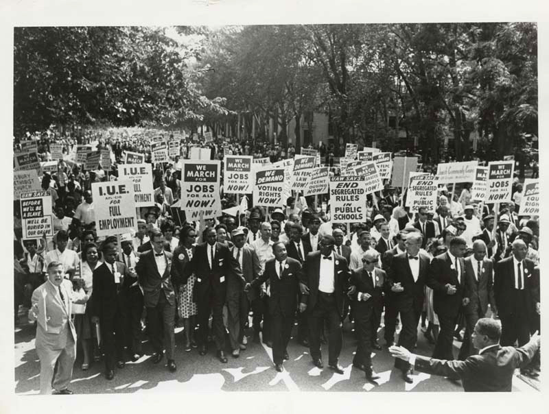 Martin Luther King Jr, centre, leads the March on Washington for Jobs and Freedom in 1963.