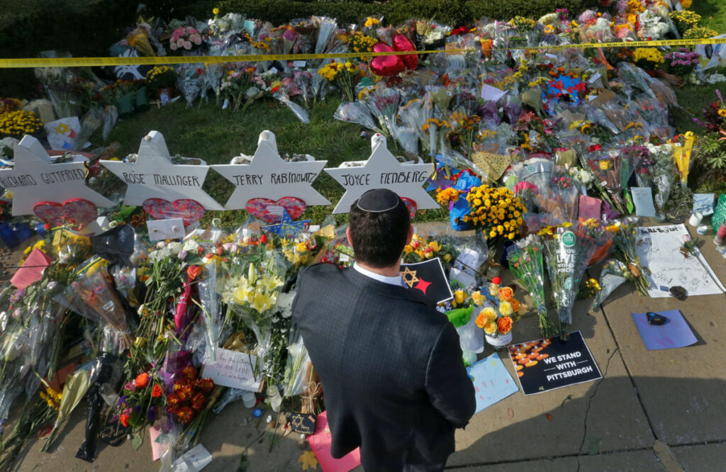 A man prays at a makeshift memorial outside the Tree of Life synagogue in Pittsburgh, Pennsylvania, on 31st October, 2018.