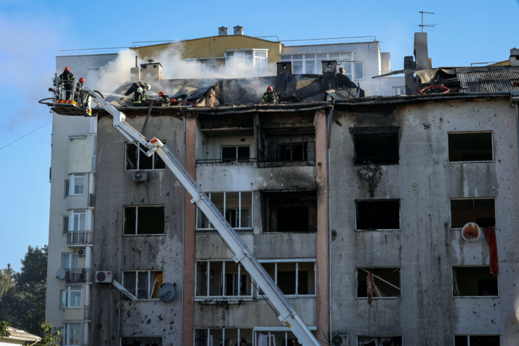 Rescuers work at the site of a residential building destroyed during a Russian military strike in Lviv, Ukraine, on 15th August, 2023