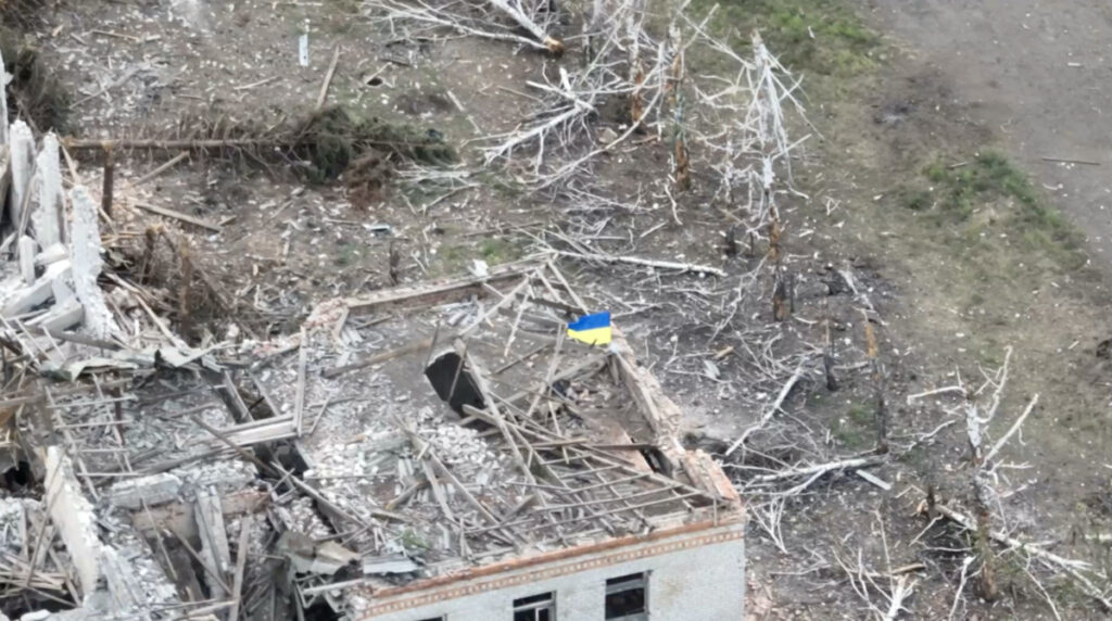 Ukrainian forces raise the national flag in the settlement of Robotyne, Zaporizhzhia region, Ukraine, in this screen grab taken from a social media video released on 23rd August, 2023.
