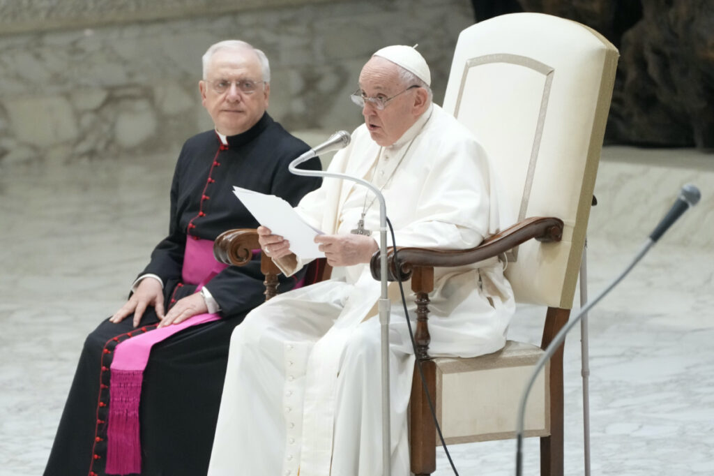 Pope Francis reads his speech during the general audience in the Paul VI hall at the Vatican, on, 9th August, 2023.