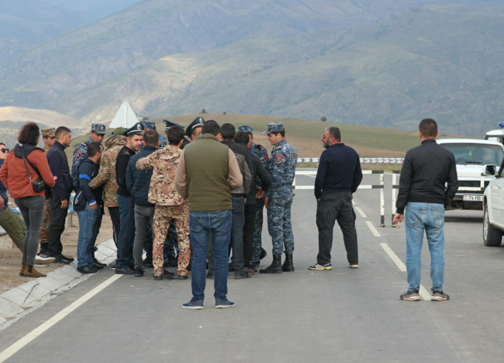 People gather near the Armenian border guard post on the road leading from Armenia to Azerbaijan's Nagorno-Karabakh region, near the village of Kornidzor, Armenia, on 21st September, 2023.