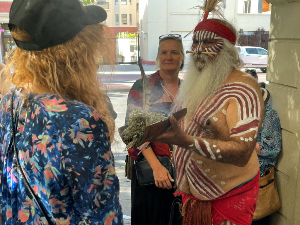 A Kaurna elder, Uncle Moogy, performs a traditional smoking ceremony with spectators, in Adelaide, Australia, on 23rd February, 2023