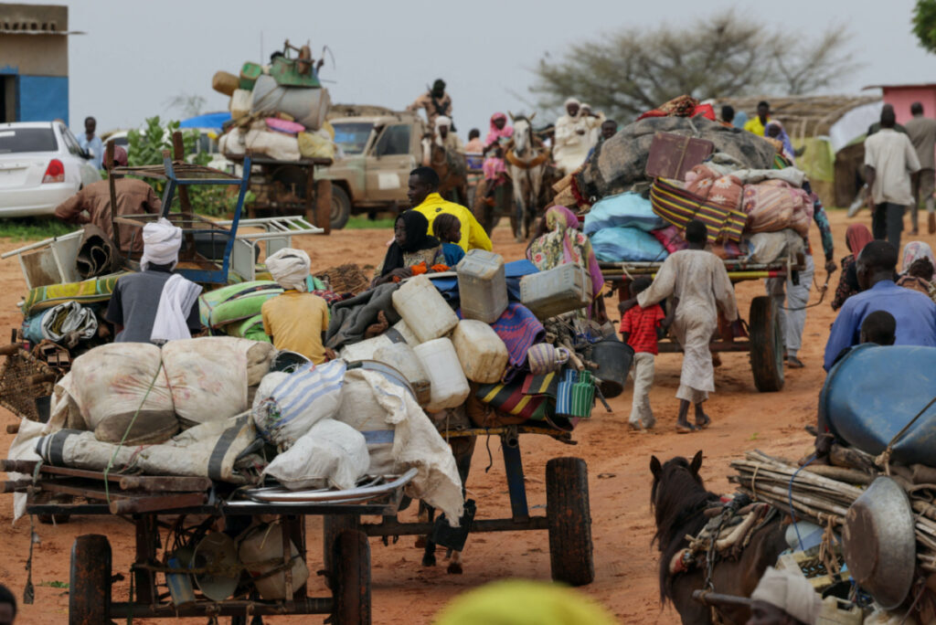 Chadian cart owners transport belongings of Sudanese people who fled the conflict in Sudan's Darfur region, while crossing the border between Sudan and Chad in Adre, Chad on 4th August, 2023