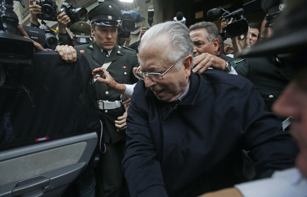 Priest Fernando Karadima is escorted from court after testifying in a case, brought by three victims of his sex abuse, in Santiago, Chile, on 11th November, 2015