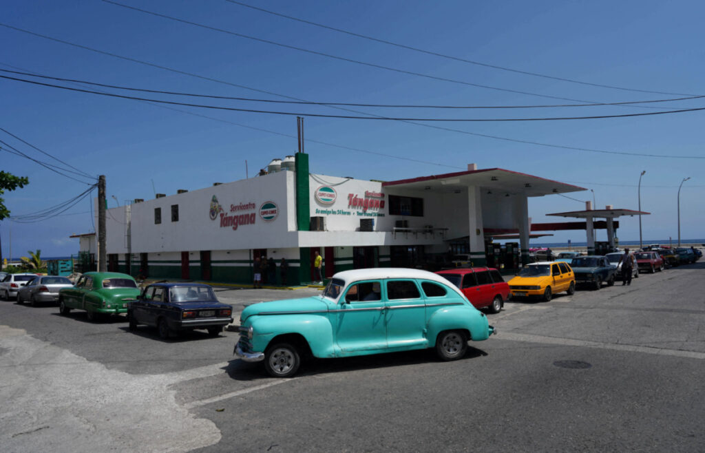 People line up their cars waiting for electricity to fill up their tanks at a gas station in Havana, Cuba, on 11th August, 2022