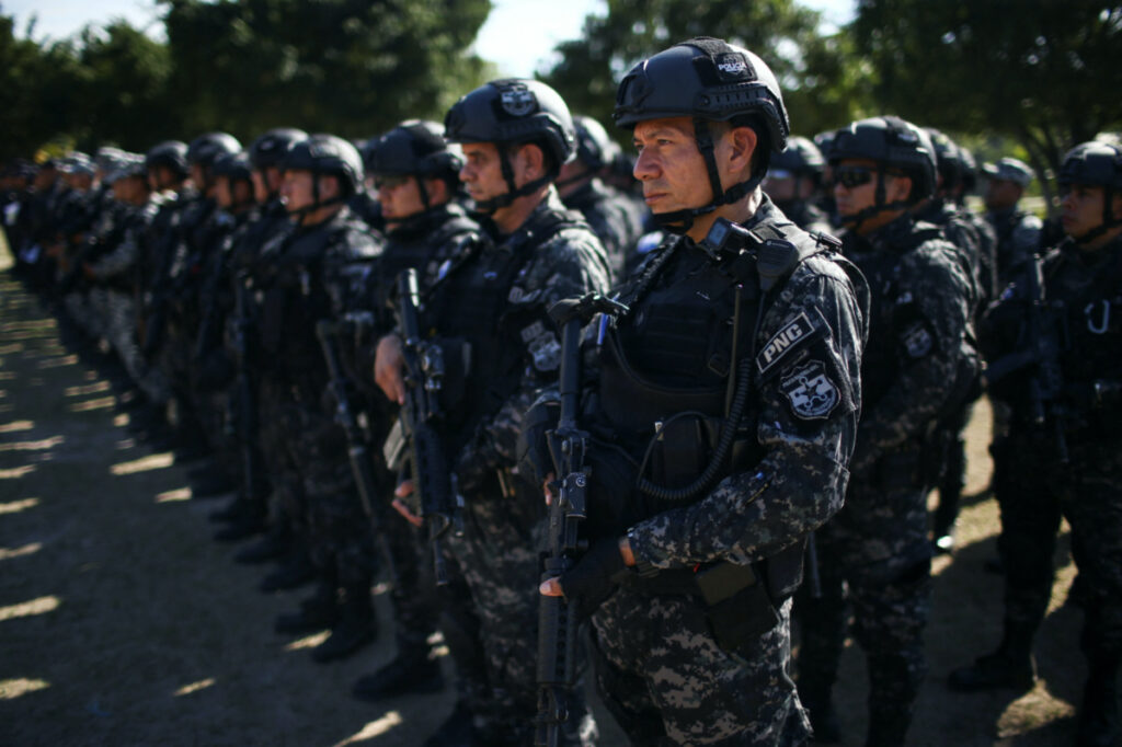 Policemen prepare for an anti-gang patrol following a year-long state of emergency against gangs, in Soyapango, El Salvador, on 24th March, 2023.