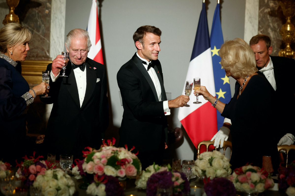 French President Emmanuel Macron, his wife Brigitte Macron, Britain's King Charles and Queen Camilla toast during a state dinner in the Hall of Mirrors at the Chateau de Versailles in Versailles, near Paris, on the first day of their State visit to France, on 20th September, 2023