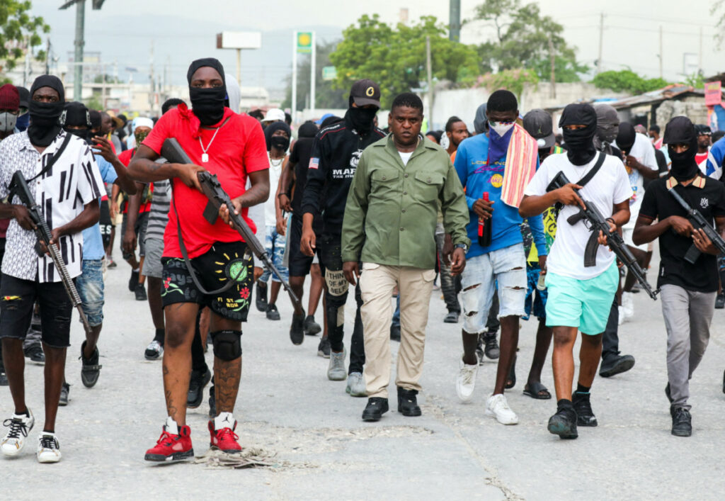 Former police officer Jimmy "Barbecue" Cherizier, leader of the 'G9' coalition, leads a march surrounded by his security against Haiti's Prime Minister Ariel Henry, in Port-au-Prince, Haiti, on 19th September, 2023.