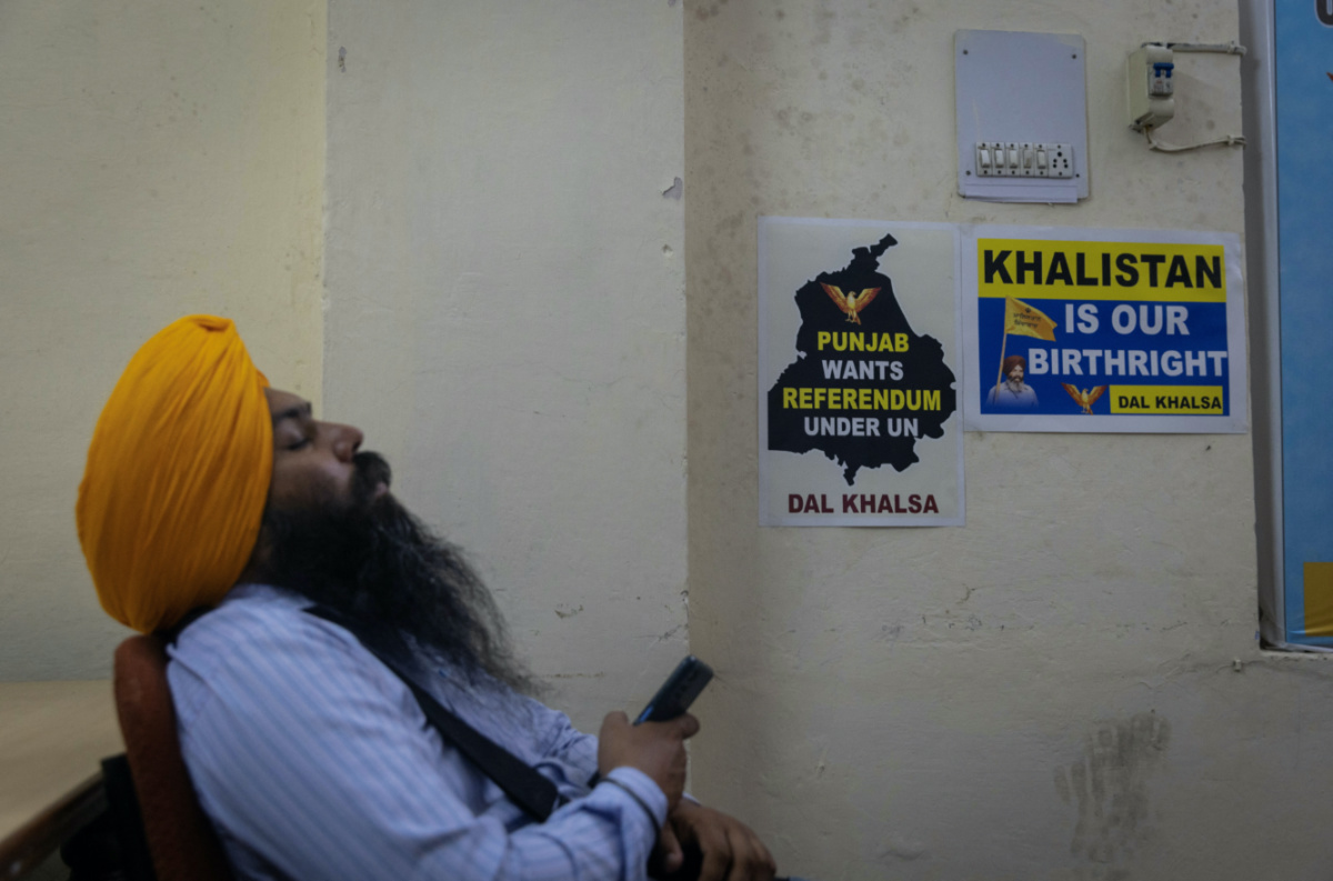 A member of the Dal Khalsa, a radical Sikh group, takes a nap inside their office in Amritsar, in the northern state of Punjab, India, on 20th September, 2023.