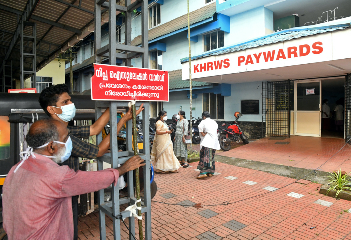 Staff members install a sign reading "Nipah isolation ward, entry strictly prohibited" at a hospital where a ward is being prepared for suspected Nipah virus patients in Kozhikode district, Kerala, India, on 12th September, 2023