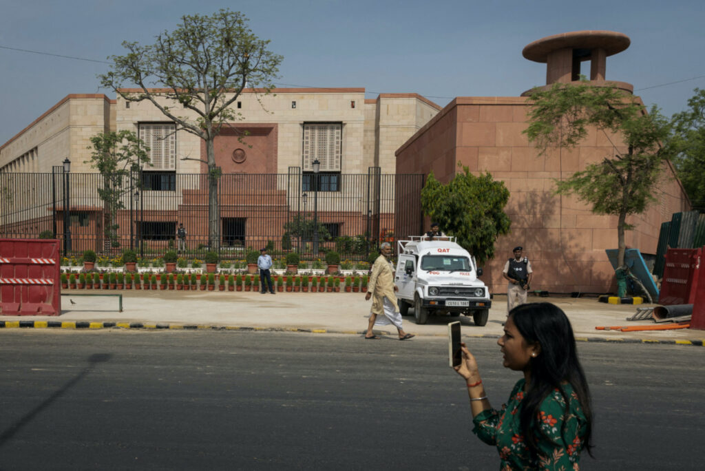 A member of media works outside the India's new parliament building before its inauguration in New Delhi, India, on 28th May, 2023.