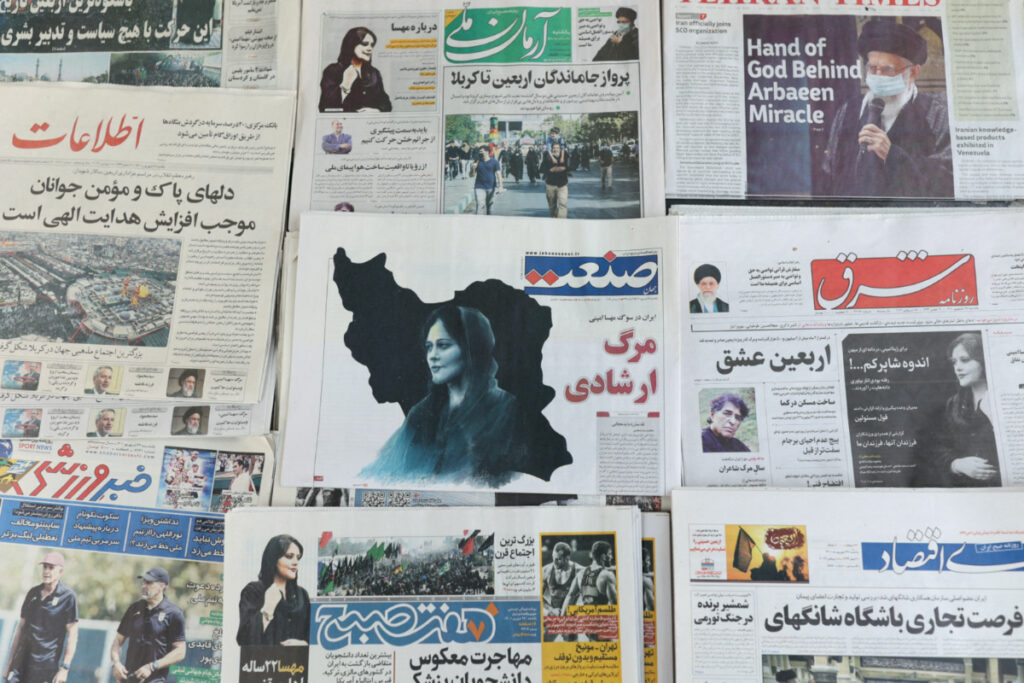 Newspapers, with a cover picture of Mahsa Amini, a woman who died after being arrested by the Islamic republic's "morality police" are seen in Tehran, Iran, on 18th September, 2022