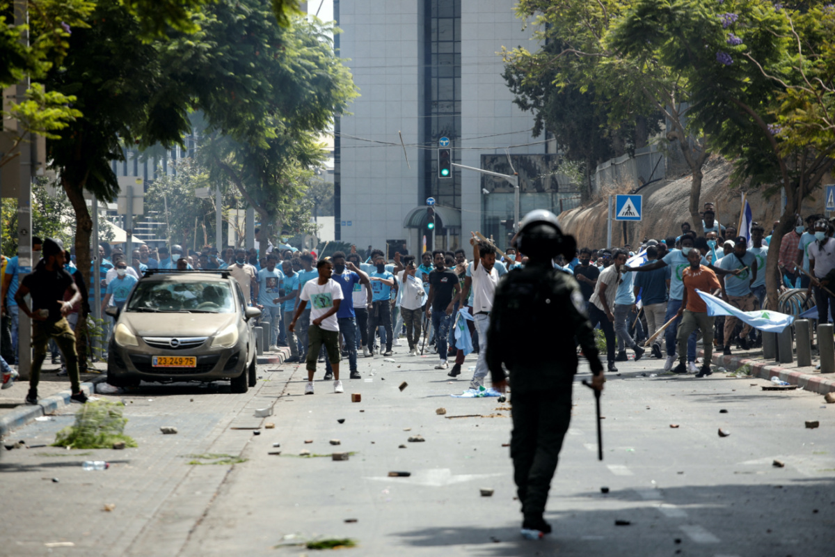 Protesters hold sticks and flags during violent demonstrations by Eritrean asylum seekers, including both supporters and opponents of the Eritrean government, in Tel Aviv, Israel, on 2nd September, 2023